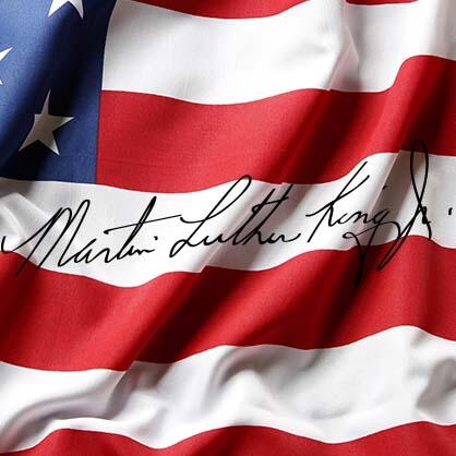 The American flag with the words Martin Luther King Jr Day, written over the top.?